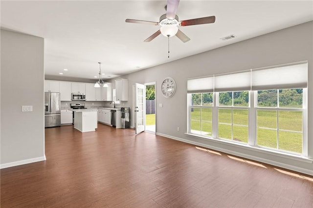 107 Heatherly Way, Brunswick, GA 31523 - unfurnished living room with dark wood finished floors, ceiling fan, and recessed lighting