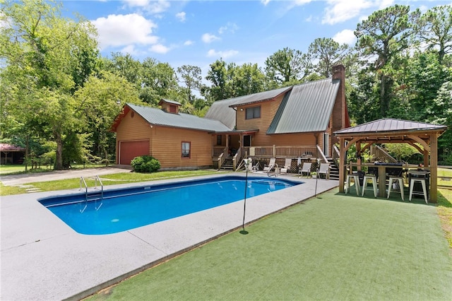 4936 US Highway 17 N, Brunswick, GA 31525 - outdoor pool with stairway, a lawn, a gazebo, and a deck