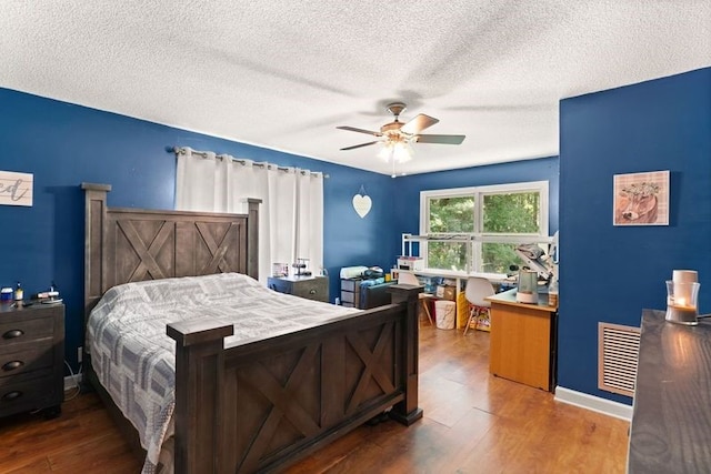 4936 US Highway 17 N, Brunswick, GA 31525 - bedroom with wood finished floors, a textured ceiling, and ceiling fan