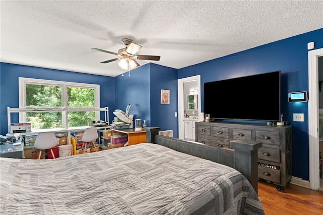 4936 US Highway 17 N, Brunswick, GA 31525 - bedroom with wood finished floors, a textured ceiling, and a ceiling fan