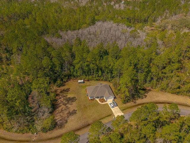 birds eye view of property with a forest view