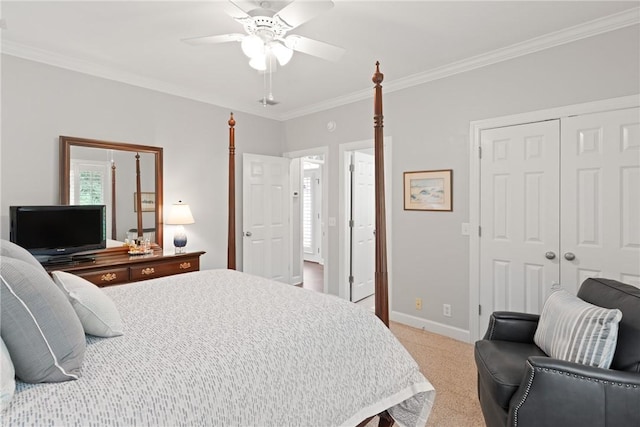 bedroom featuring crown molding, light colored carpet, a closet, a ceiling fan, and baseboards