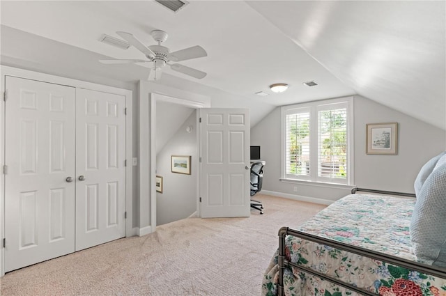 carpeted bedroom featuring vaulted ceiling, ceiling fan, baseboards, and a closet