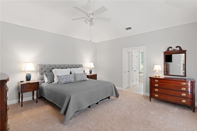 bedroom with light carpet, baseboards, a ceiling fan, and connected bathroom