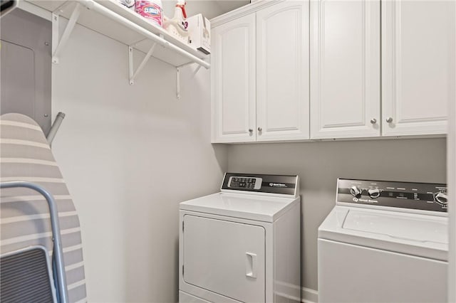 laundry area featuring cabinet space and washer and clothes dryer