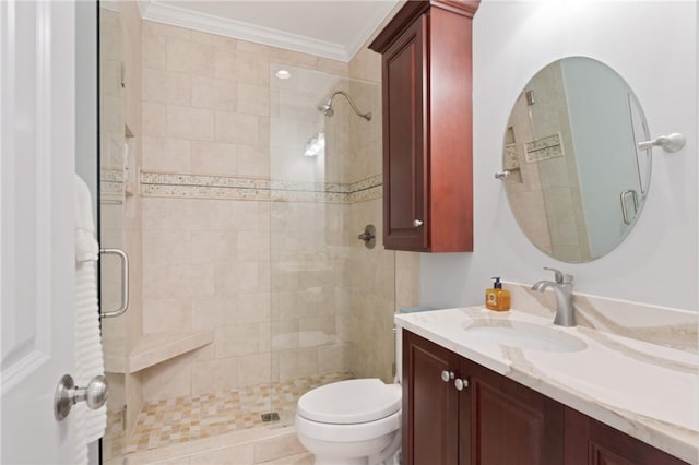 full bath featuring a stall shower, crown molding, toilet, and vanity