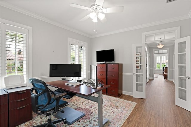 office area featuring french doors, wood finished floors, ornamental molding, baseboards, and ceiling fan