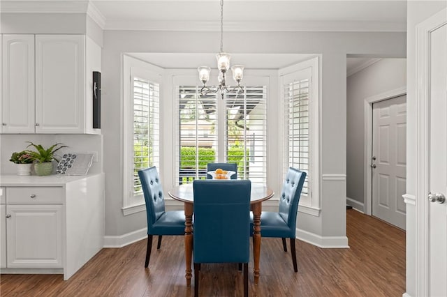 dining room with a chandelier, baseboards, wood finished floors, and ornamental molding