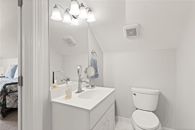 bathroom featuring vanity, toilet, and ensuite bath