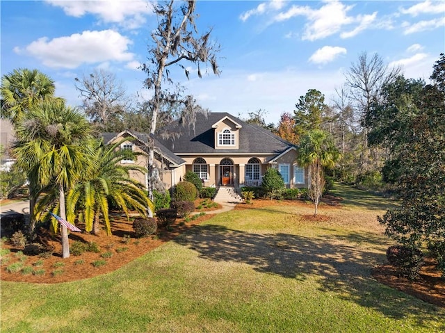 view of front of home featuring a front yard and a porch