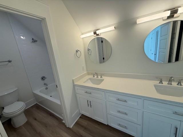 117 Quamley Wells Dr, Saint Simons Island, GA 31522 - full bathroom with toilet, wood finished floors, double vanity, and shower / tub combination