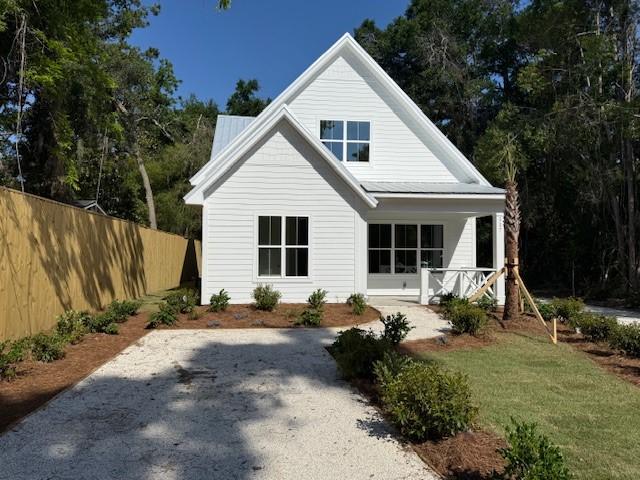 117 Quamley Wells Dr, Saint Simons Island, GA 31522 - back of house featuring covered porch
