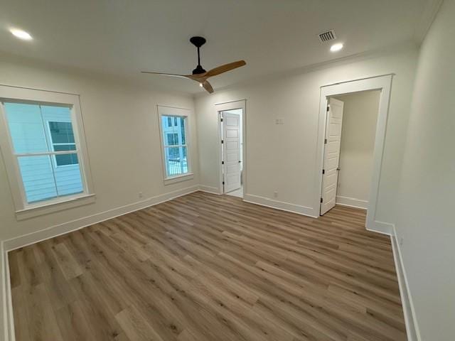 117 Quamley Wells Dr, Saint Simons Island, GA 31522 - unfurnished room with wood finished floors, baseboards, a ceiling fan, and recessed lighting