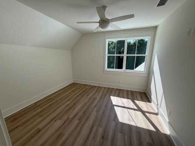 117 Quamley Wells Dr, Saint Simons Island, GA 31522 - additional living space featuring wood finished floors, vaulted ceiling, baseboards, and ceiling fan