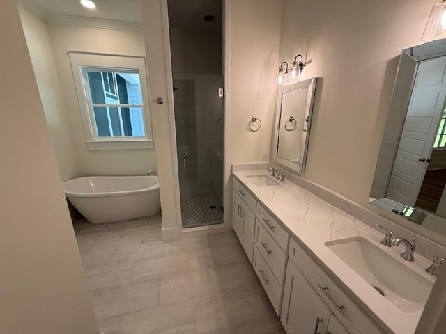 117 Quamley Wells Dr, Saint Simons Island, GA 31522 - full bathroom featuring double vanity, a stall shower, a freestanding bath, and tile patterned flooring