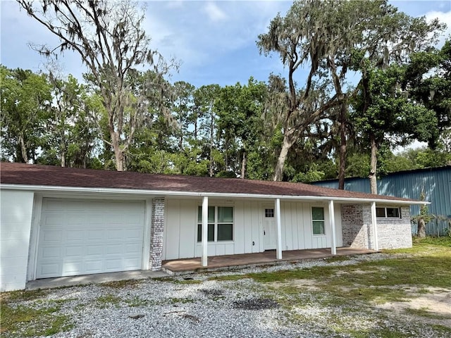 4726 New Jesup Hwy, Brunswick, GA 31520 - single story home featuring a garage, covered porch, driveway, and board and batten siding
