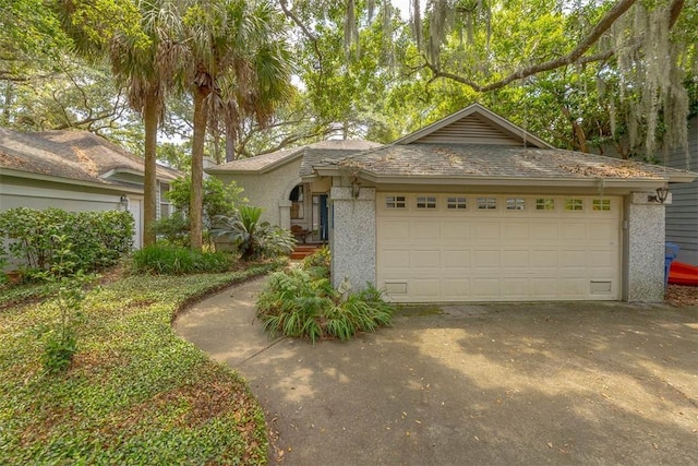 40 W Lake Dr, Saint Simons Island, GA 31522 - ranch-style home featuring a garage and driveway