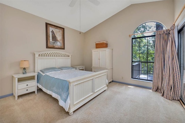 40 W Lake Dr, Saint Simons Island, GA 31522 - bedroom featuring light colored carpet, vaulted ceiling, baseboards, and ceiling fan