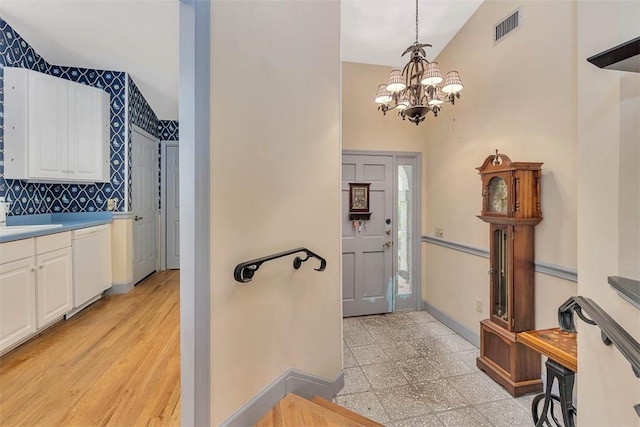 40 W Lake Dr, Saint Simons Island, GA 31522 - foyer entrance with a chandelier and baseboards