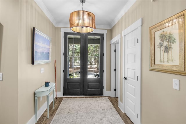 entryway featuring french doors, ornamental molding, and dark hardwood / wood-style flooring