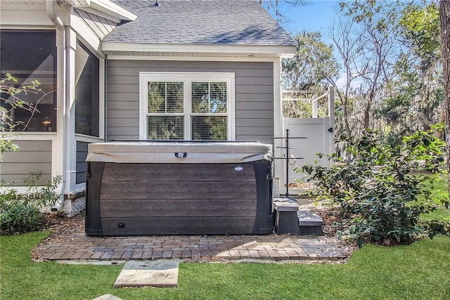 exterior details featuring a hot tub