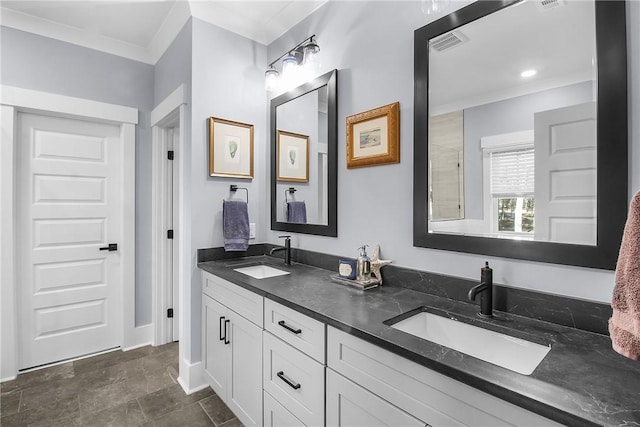 bathroom with vanity and ornamental molding