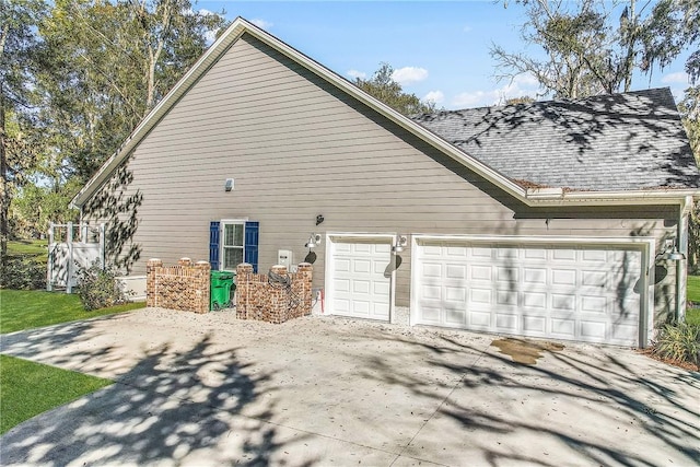 view of property exterior featuring a garage