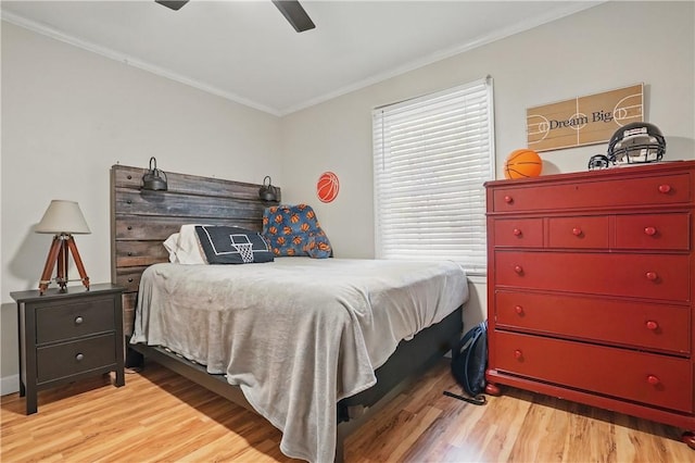 408 Couper Ave, Saint Simons Island, GA 31522 - bedroom with crown molding, wood finished floors, and ceiling fan