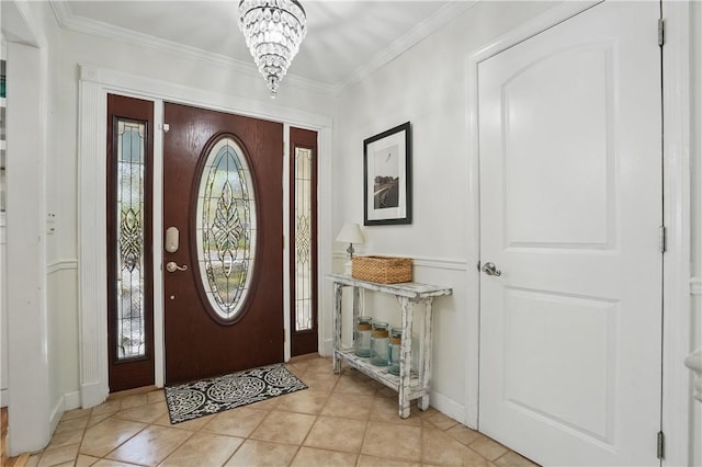 408 Couper Ave, Saint Simons Island, GA 31522 - entrance foyer with crown molding, a chandelier, baseboards, and light tile patterned floors