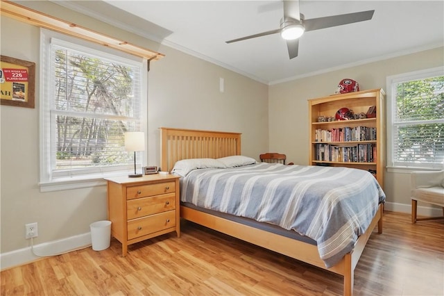 408 Couper Ave, Saint Simons Island, GA 31522 - bedroom with light wood-style floors, ornamental molding, baseboards, and ceiling fan