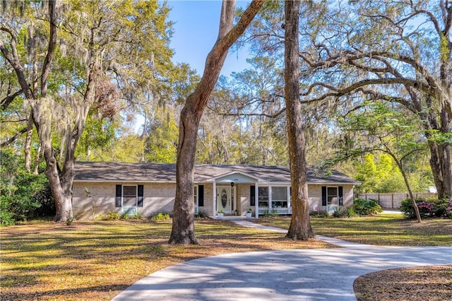408 Couper Ave, Saint Simons Island, GA 31522 - ranch-style house with a porch and driveway