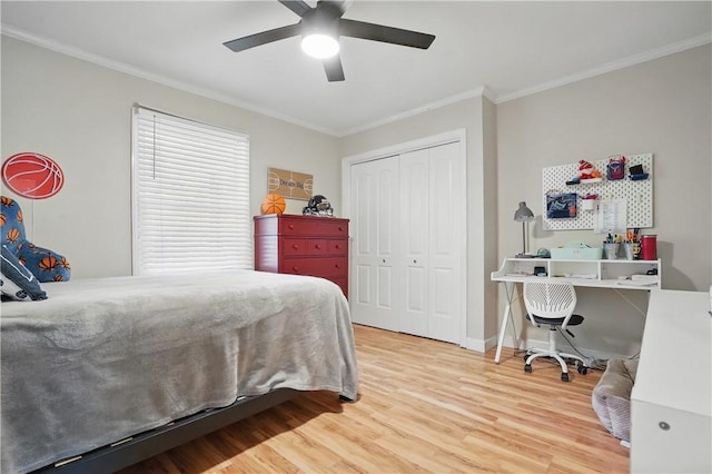 408 Couper Ave, Saint Simons Island, GA 31522 - bedroom featuring wood finished floors, crown molding, a closet, a ceiling fan, and baseboards