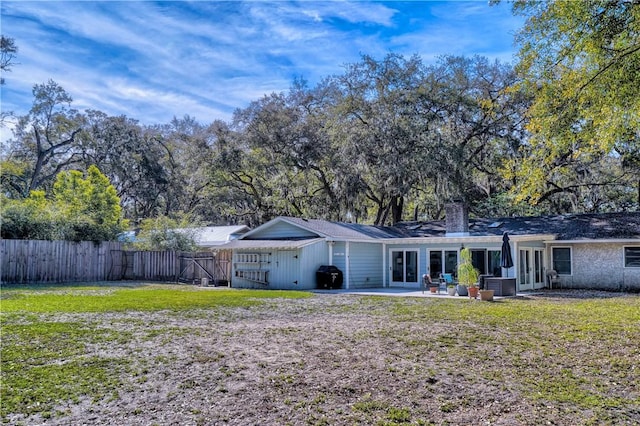 408 Couper Ave, Saint Simons Island, GA 31522 - back of house with a patio, a chimney, and french doors