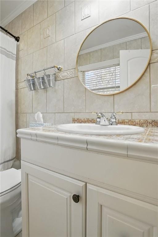 408 Couper Ave, Saint Simons Island, GA 31522 - full bathroom featuring tile walls, vanity, decorative backsplash, toilet, and a shower with shower curtain