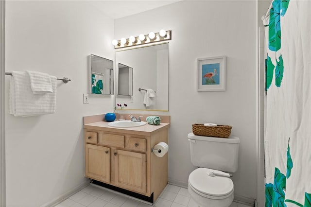 1704 Frederica Rd Unit 508, Saint Simons Island, GA 31522 - bathroom featuring vanity, toilet, tile patterned floors, a shower with curtain, and baseboards