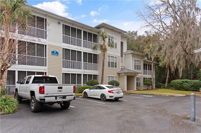 1704 Frederica Rd Unit 508, Saint Simons Island, GA 31522 - view of building exterior featuring uncovered parking