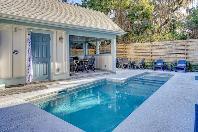 view of swimming pool with a patio