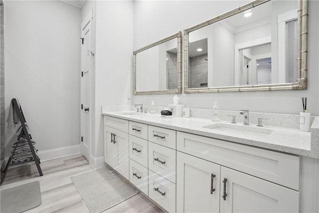 bathroom with vanity and hardwood / wood-style floors