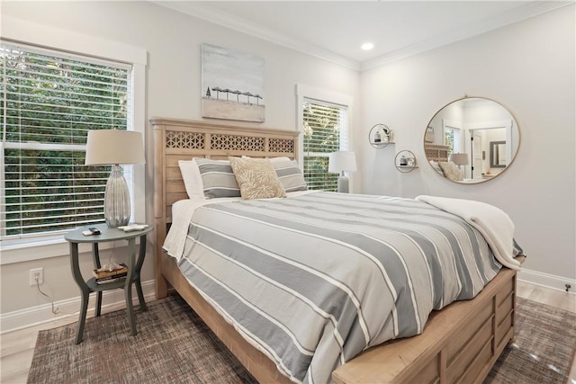 bedroom featuring dark wood-type flooring and ornamental molding