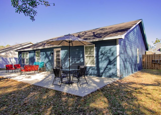 back of house with a patio