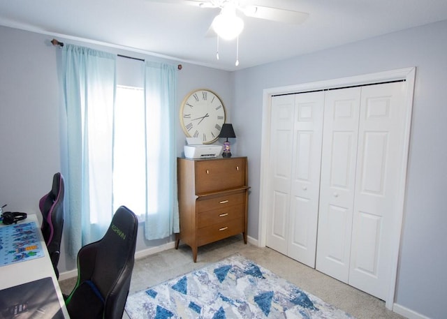 carpeted office with ceiling fan