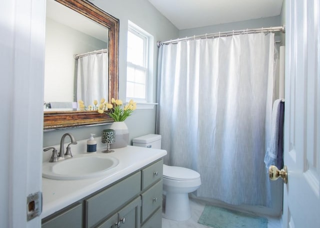 bathroom with vanity, toilet, and a shower with shower curtain