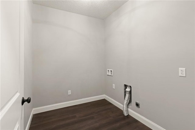 washroom with dark hardwood / wood-style flooring, hookup for a washing machine, a textured ceiling, and hookup for an electric dryer