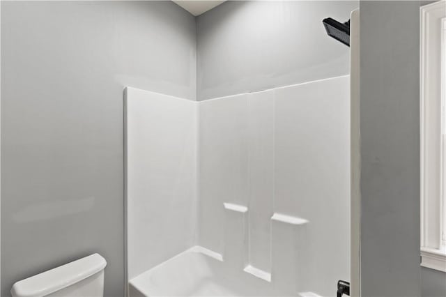 bathroom with  shower combination and toilet