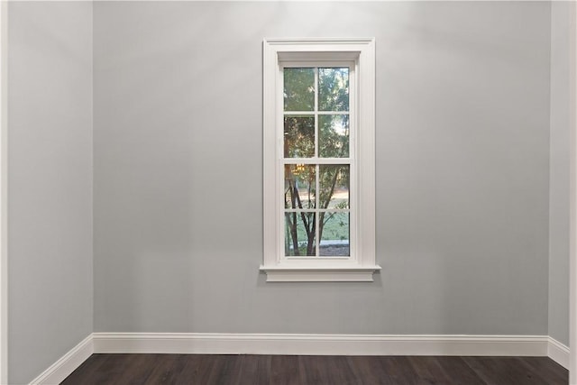 unfurnished room featuring dark hardwood / wood-style flooring