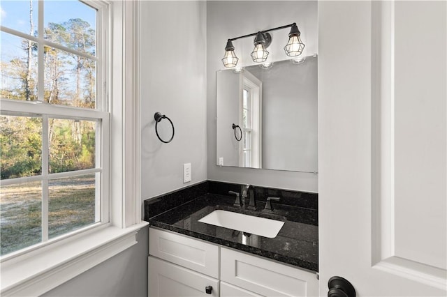 bathroom with vanity and a healthy amount of sunlight