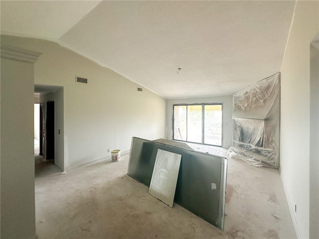 47 Marsh View Ct, Saint Marys, GA 31558 - unfurnished living room with lofted ceiling, carpet flooring, and baseboards