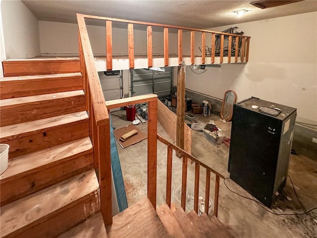 47 Marsh View Ct, Saint Marys, GA 31558 - stairs featuring concrete flooring and a textured ceiling
