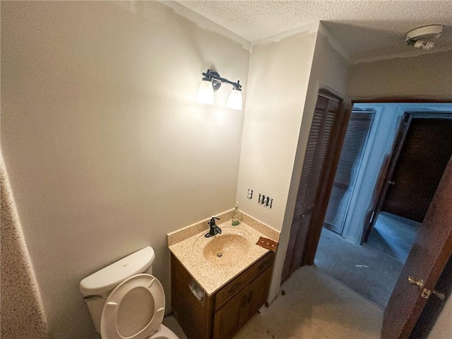 47 Marsh View Ct, Saint Marys, GA 31558 - half bath featuring toilet, a textured ceiling, and vanity