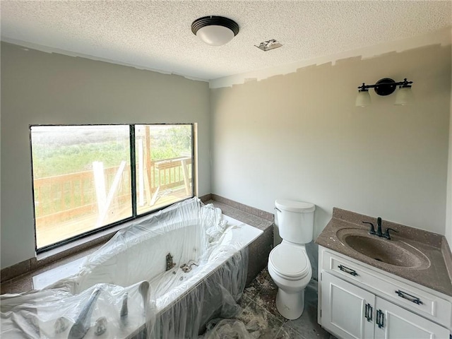47 Marsh View Ct, Saint Marys, GA 31558 - full bath featuring a textured ceiling, toilet, a garden tub, and vanity